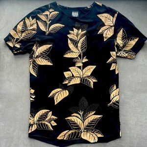 Long Fit T shirt. Black with beige leaf design.
